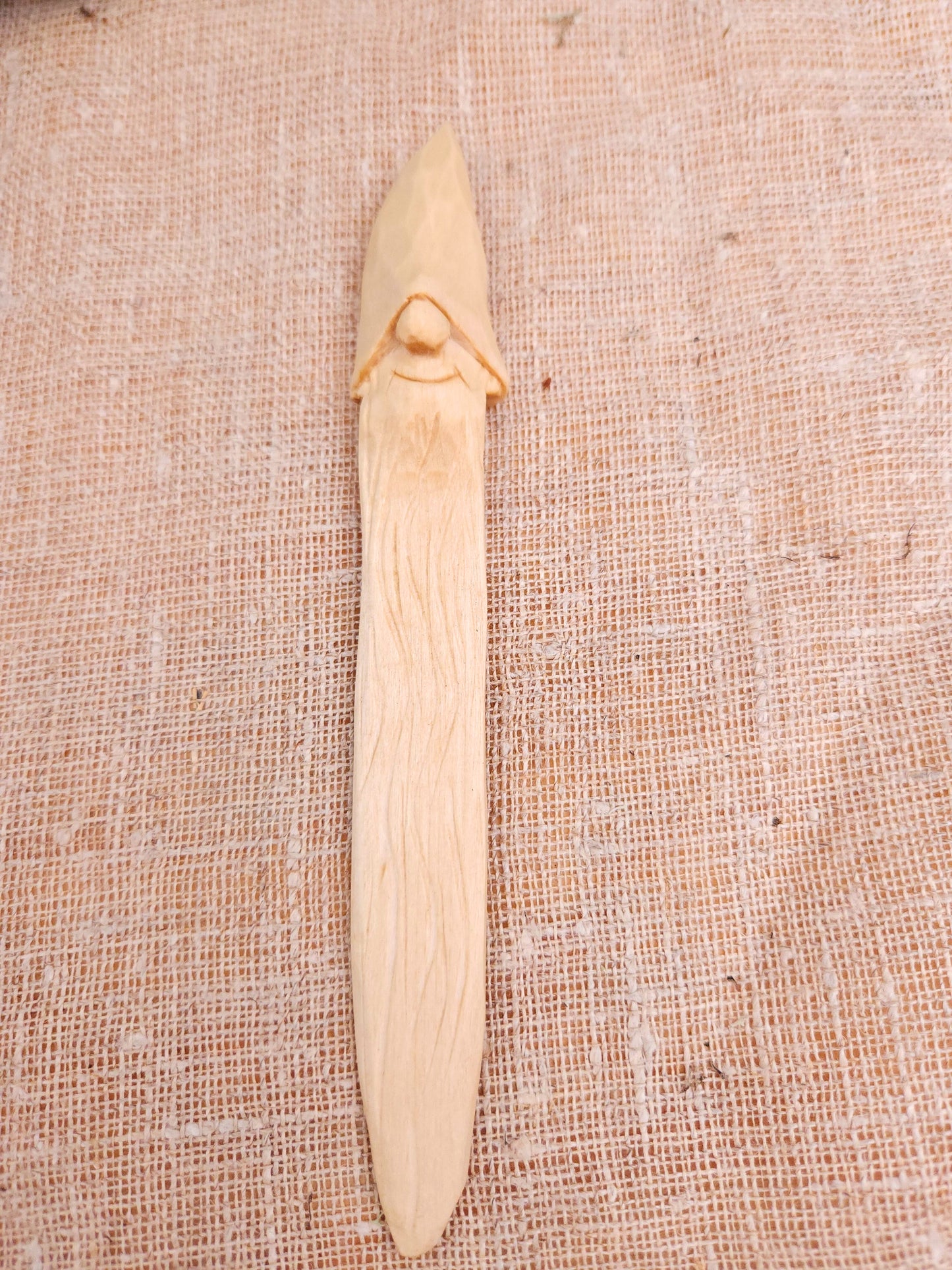 Reading bookmark with Nisse (Gnome, Wichtel) head – handmade wooden Scandinavian folk art carving, unique signed collectible and perfect Nordic gift for book lovers.