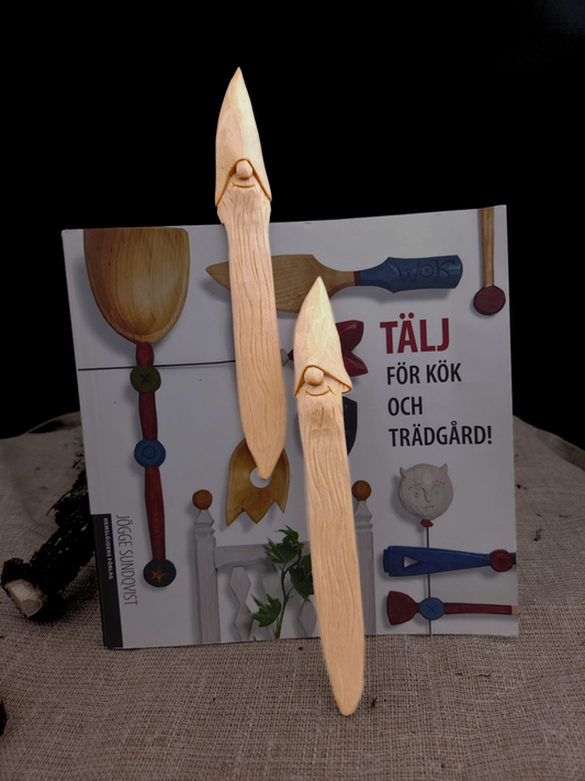Collectible reading bookmark with Nisse (Gnome, Wichtel) head – hand-carved Scandinavian wooden folk art, unique artisan gift for book collectors.
