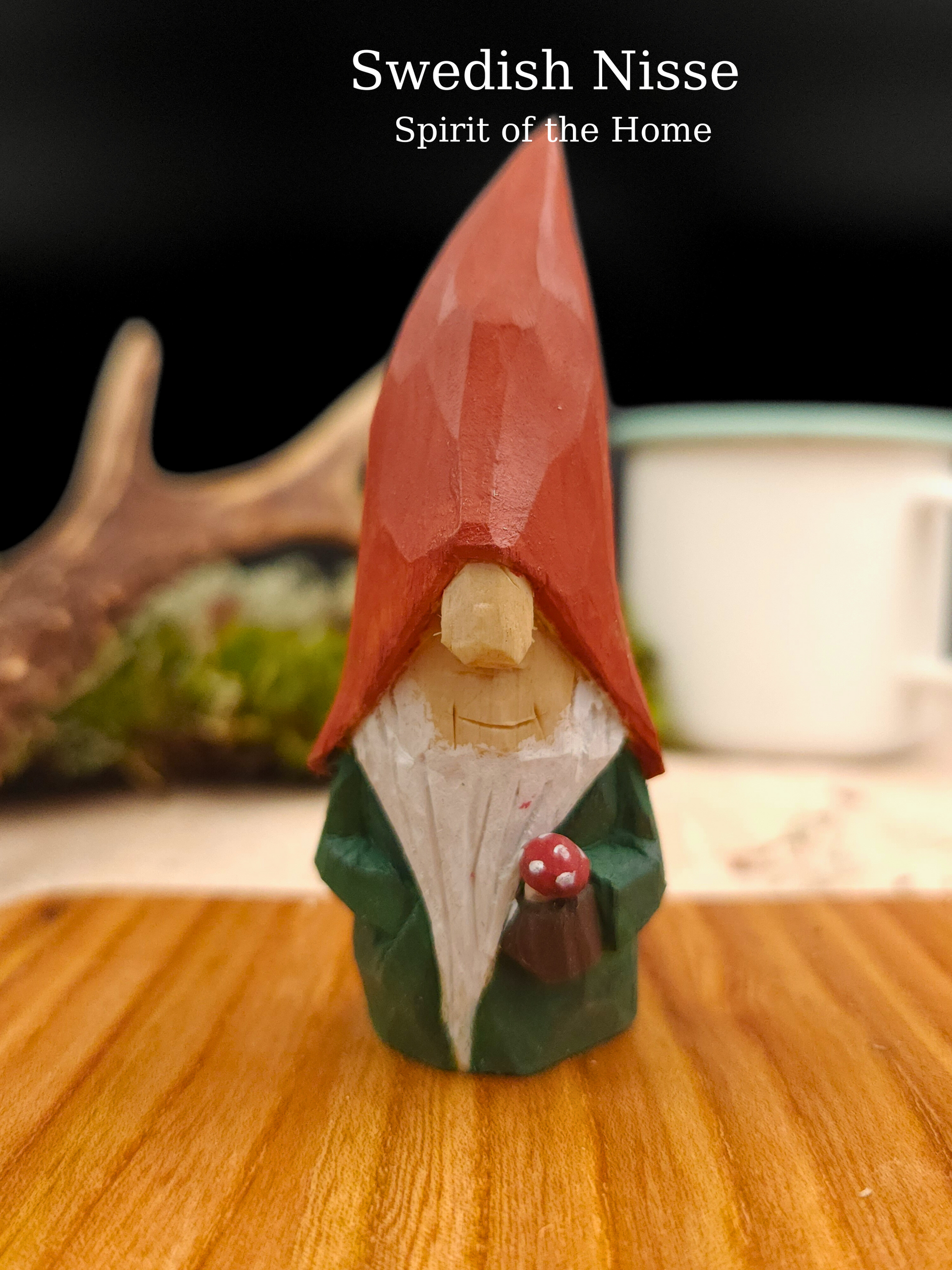 Gift idea – Autumn Nisse (Gnome, Wichtel) with red hat holding mushroom, hand-carved Scandinavian wooden folk art wood carving, unique signed collectible and Nordic seasonal decor.
