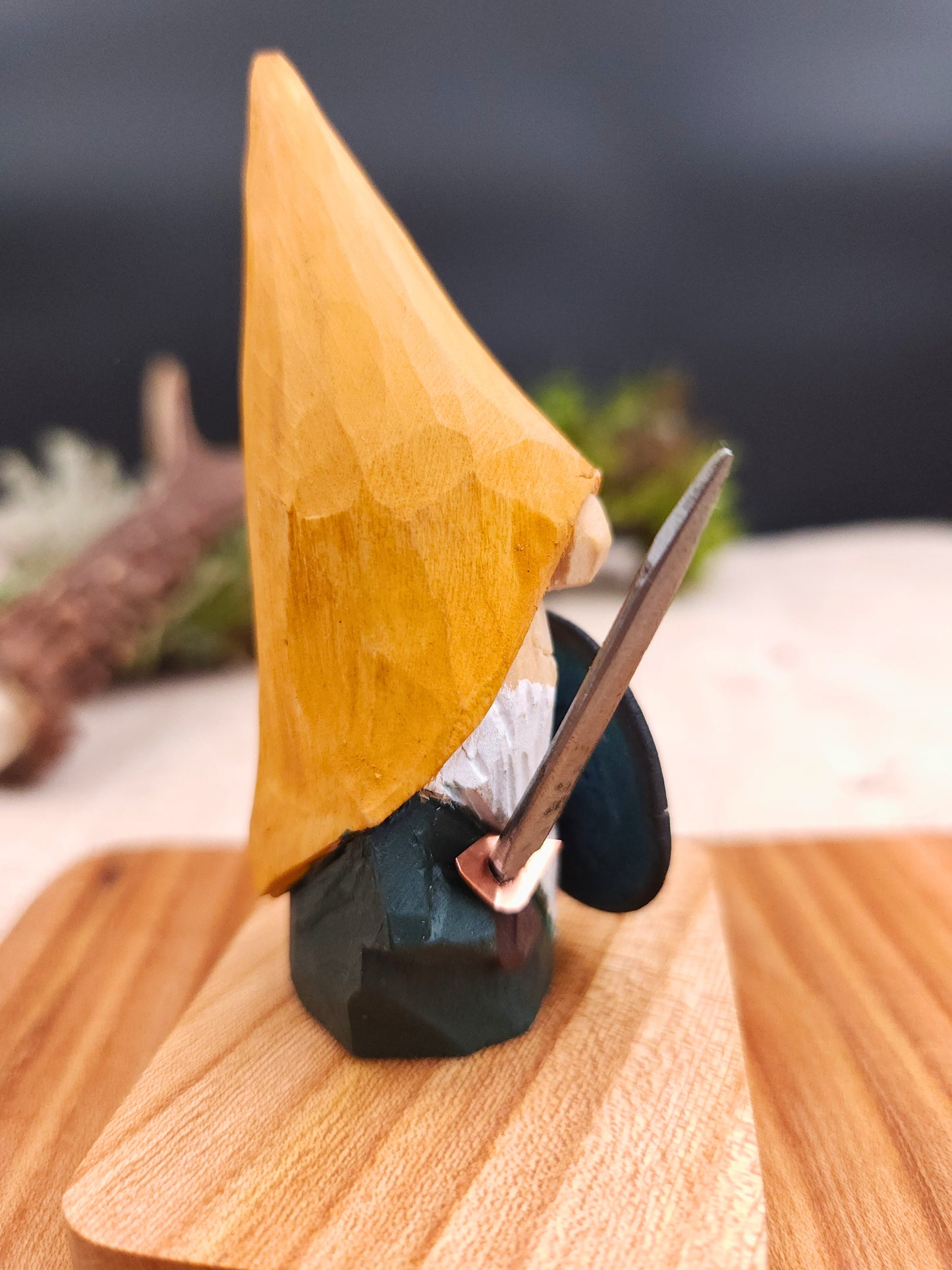 Viking Nisse (Gnome, Wichtel) with yellow hat and blue shield – hand-carved Scandinavian wooden folk art figure, unique signed collectible, Nordic mythology decor and perfect handmade gift.
